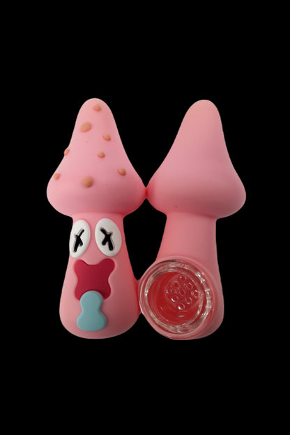 Pink Patrick Star-shaped silicone dab rig with a glass insert, isolated on a black background.