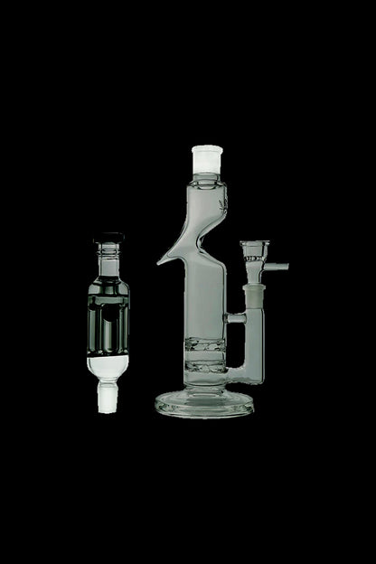 Glass bubbler and rig for cannabis concentrate use, studio shot on black background.