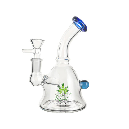 Three-quarter front view of The Kind Glass 6″ Mini Bong showing its clear glass body, blue-rimmed mouthpiece, and green logo on a white background
