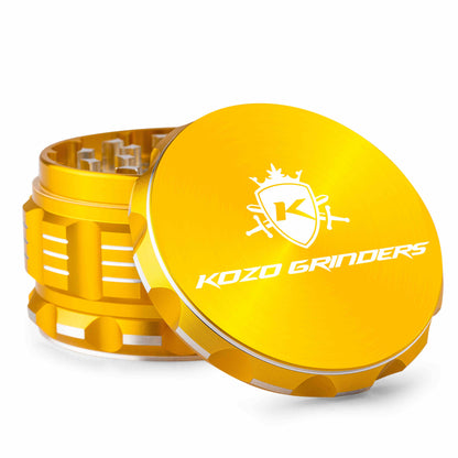 Yellow metal cannabis grinder with Kozo Grinders logo open, revealing internal grinding mechanism.
