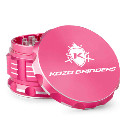 Pink Kozo Grinders cannabis grinder with white logo and branding.