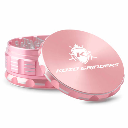 Pink Kozo Grinders cannabis grinder with open lid displaying logo.