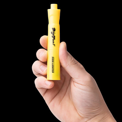 Close-up of a hand holding a bright yellow BIGFUN! High-Lighter Vaporizer upright against a solid black background.
