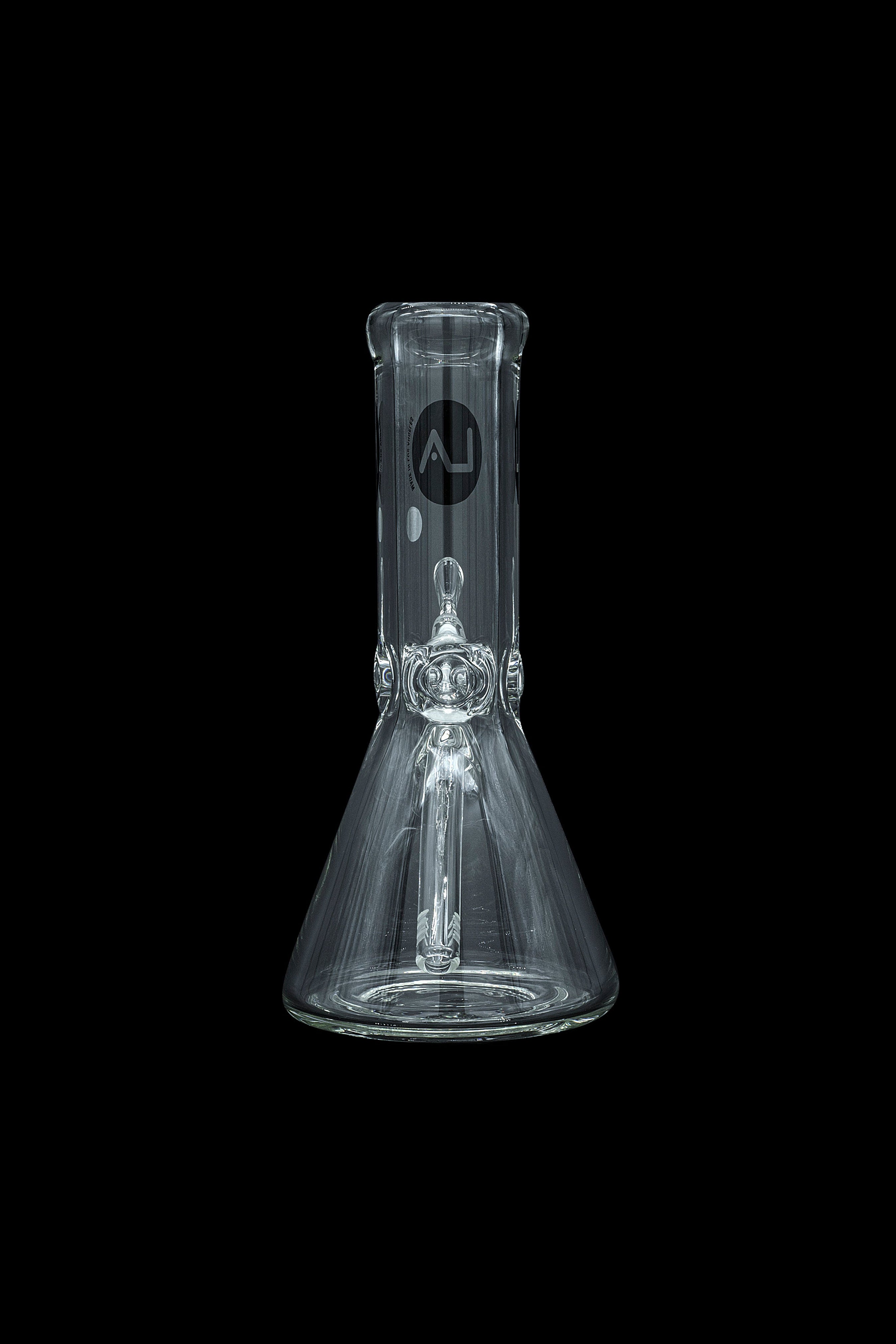 Clear glass beaker bong with intricate percolator, isolated on black.