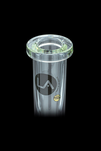 Clear glass ashtray with a green rim and “LA” logo, isolated on a black background.