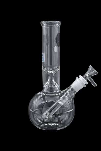 Clear glass water pipe, also known as a bong, with a downstem and bowl, isolated on a black background.