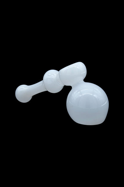 White glass bubbler water pipe against a black background.