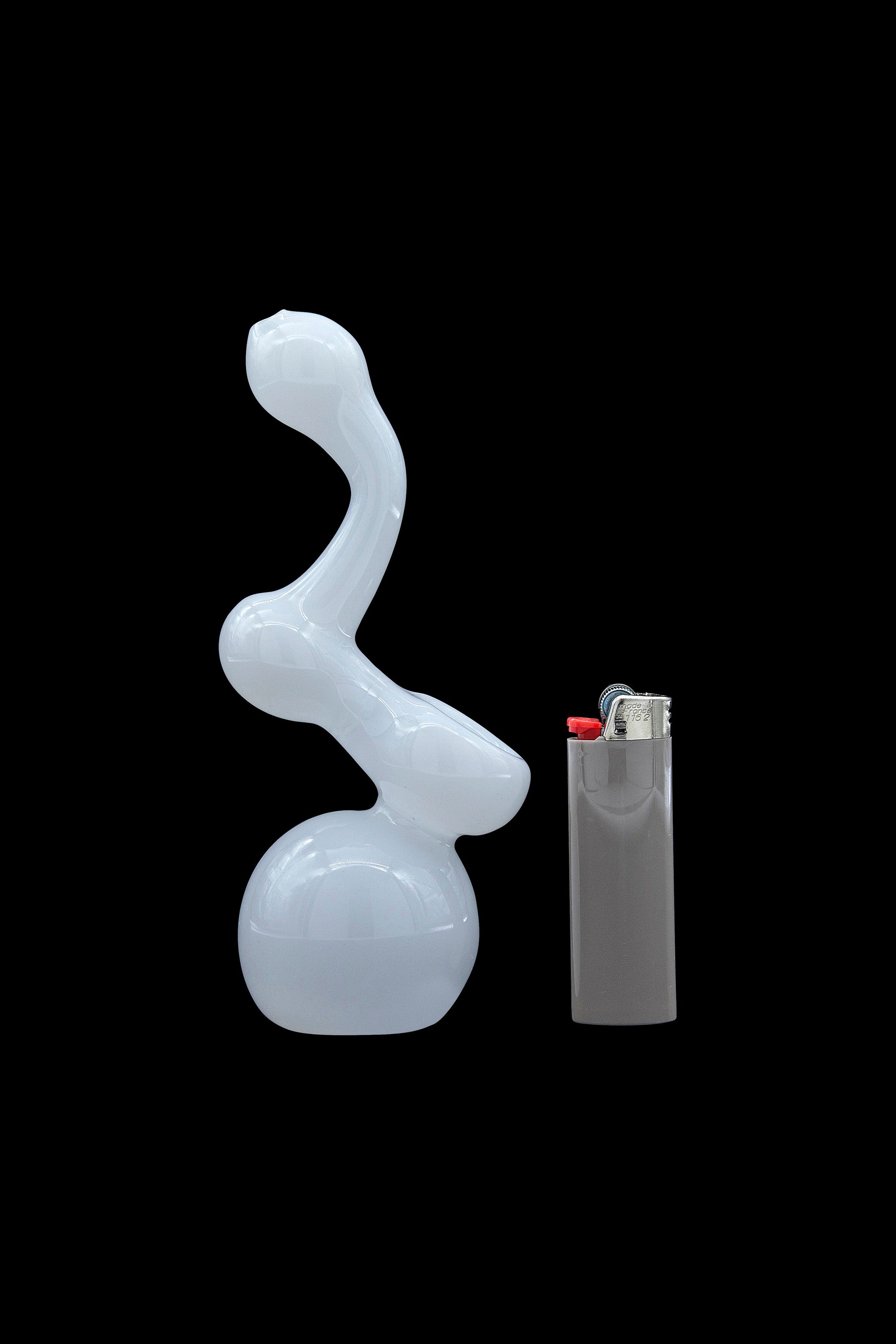 Frosted glass water pipe (bong) next to a lighter on a black background.