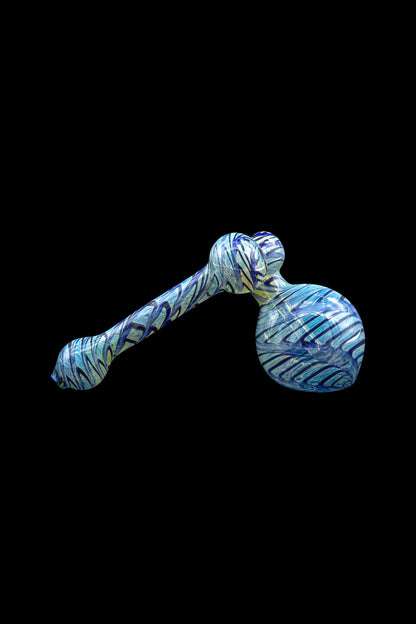 Blue and white glass bubbler pipe against a black background.