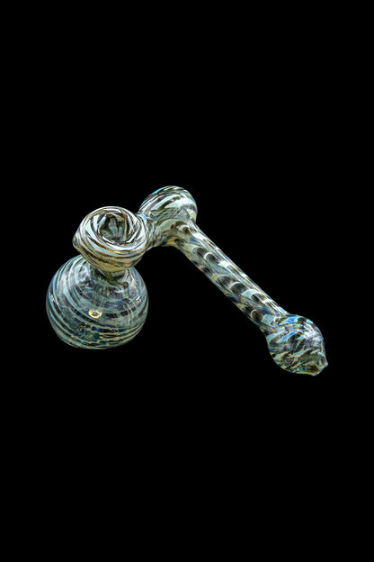 Hand-blown glass bubbler with swirling teal and white patterns.