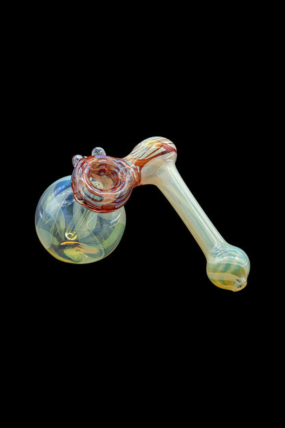 Hand-blown glass bubbler with swirling green and red patterns.