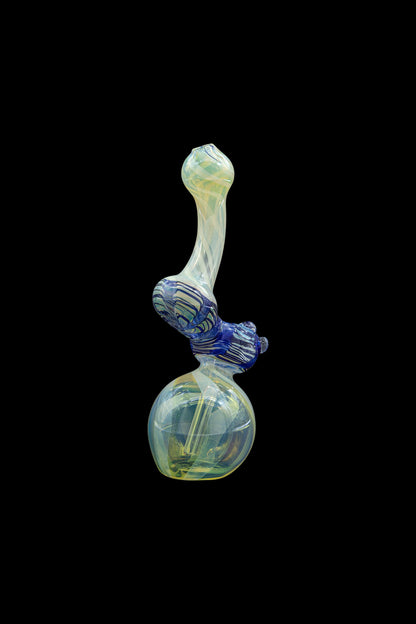 Hand-blown glass bubbler with blue and green swirls, against a black background.