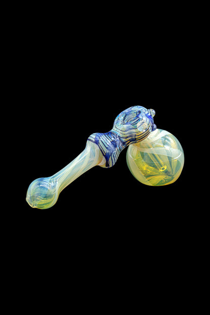 Colorful glass bubbler pipe with swirling blue and yellow patterns.