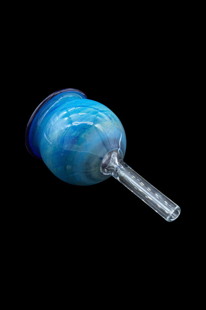 Blue glass bubbler with a clear mouthpiece, isolated on a black background.