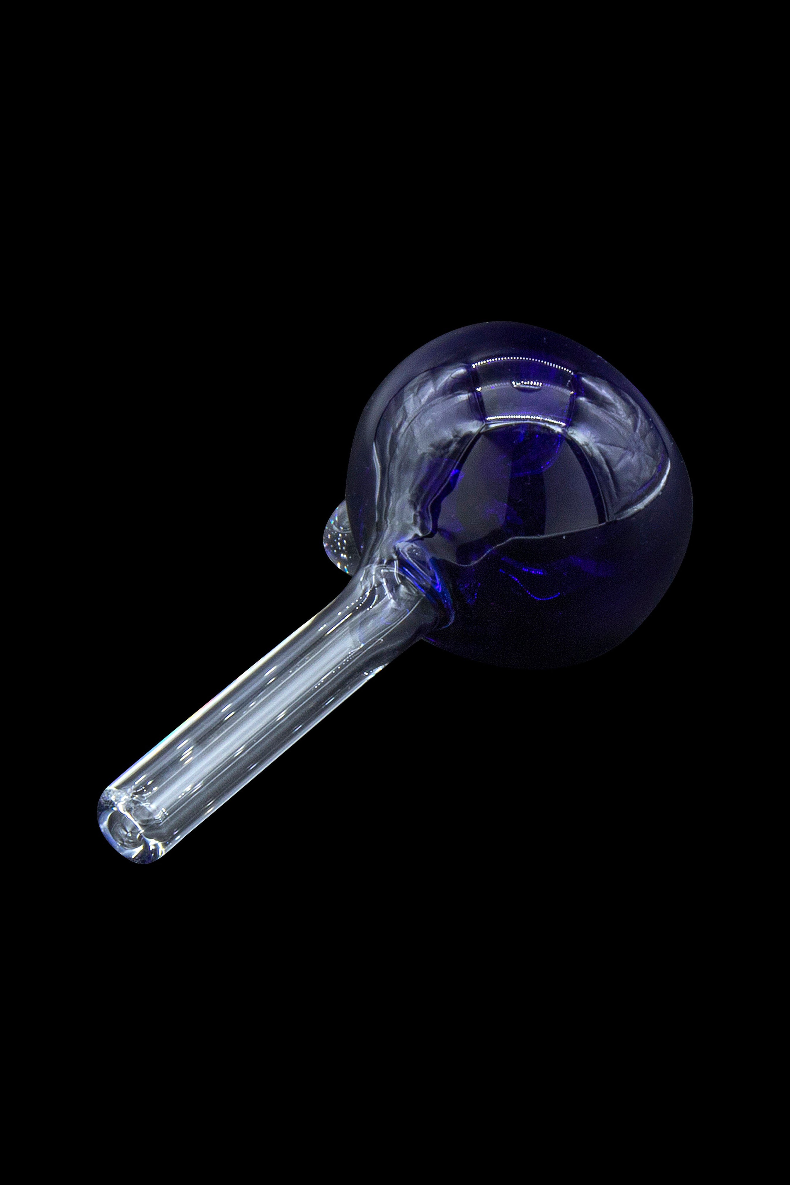 Blue glass smoking pipe on black background.