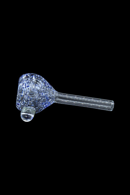 Blue and white speckled glass pipe isolated on a black background.