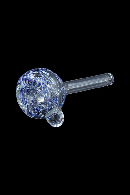 Blue and white speckled glass pipe against a black background.