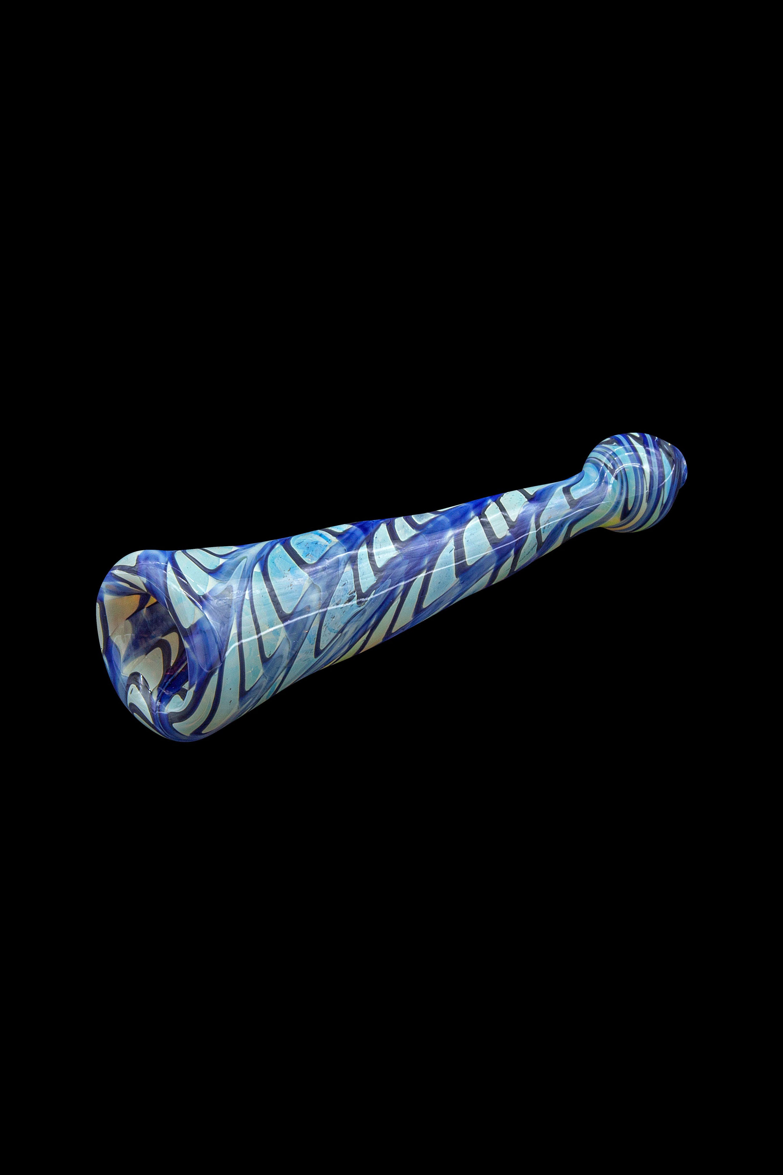 Blue and white patterned glass pipe isolated on a black background.