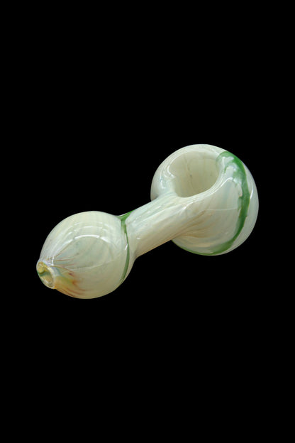 Pale green glass pipe isolated on a black background.