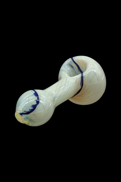Glass smoking pipe with iridescent green and blue swirls, isolated on a black background.