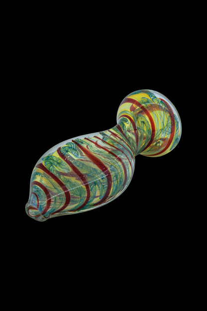 Hand-blown glass cannabis oil burner pipe with vibrant green, red, and yellow swirls.