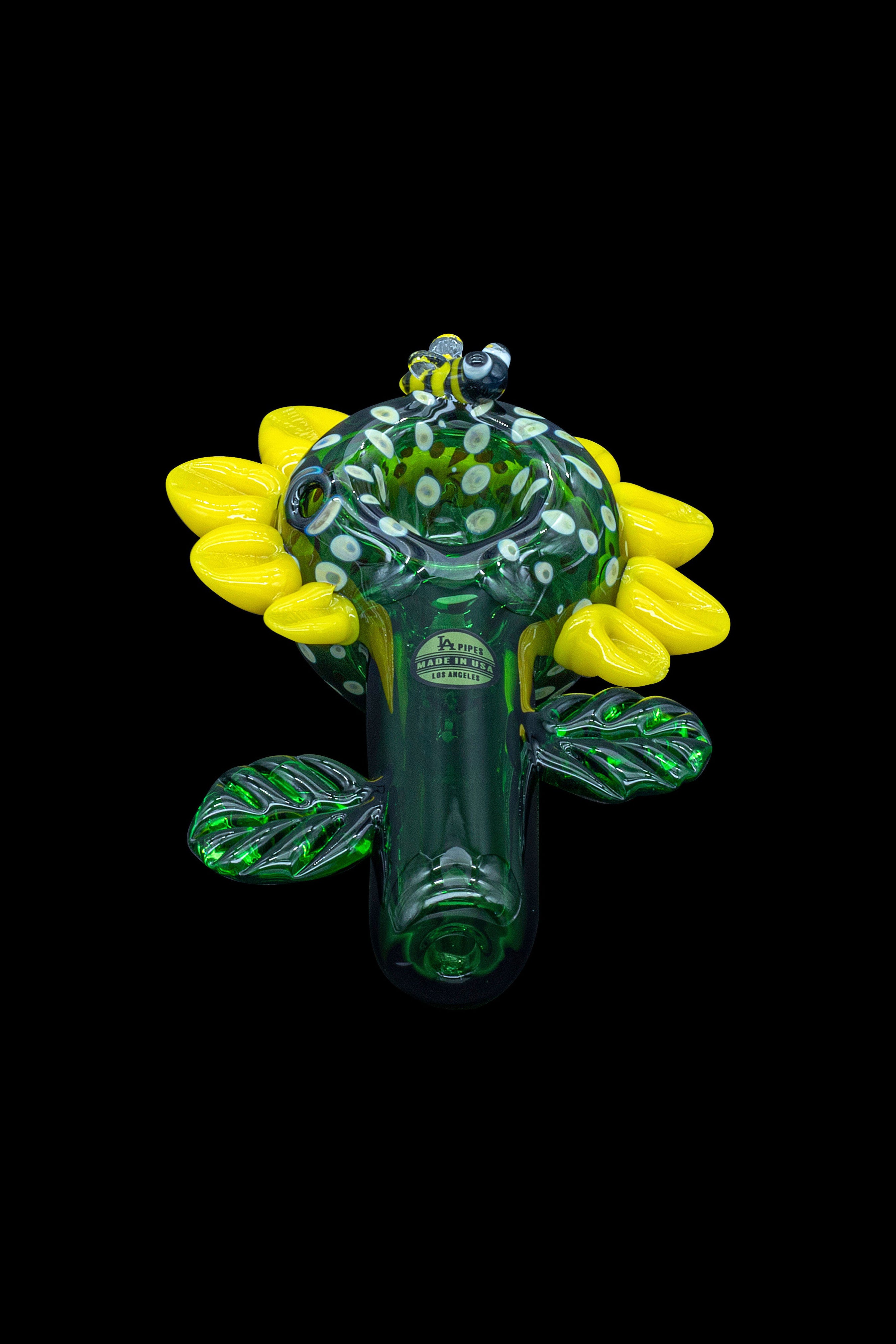 Green glass cannabis water pipe shaped like a blooming flower.