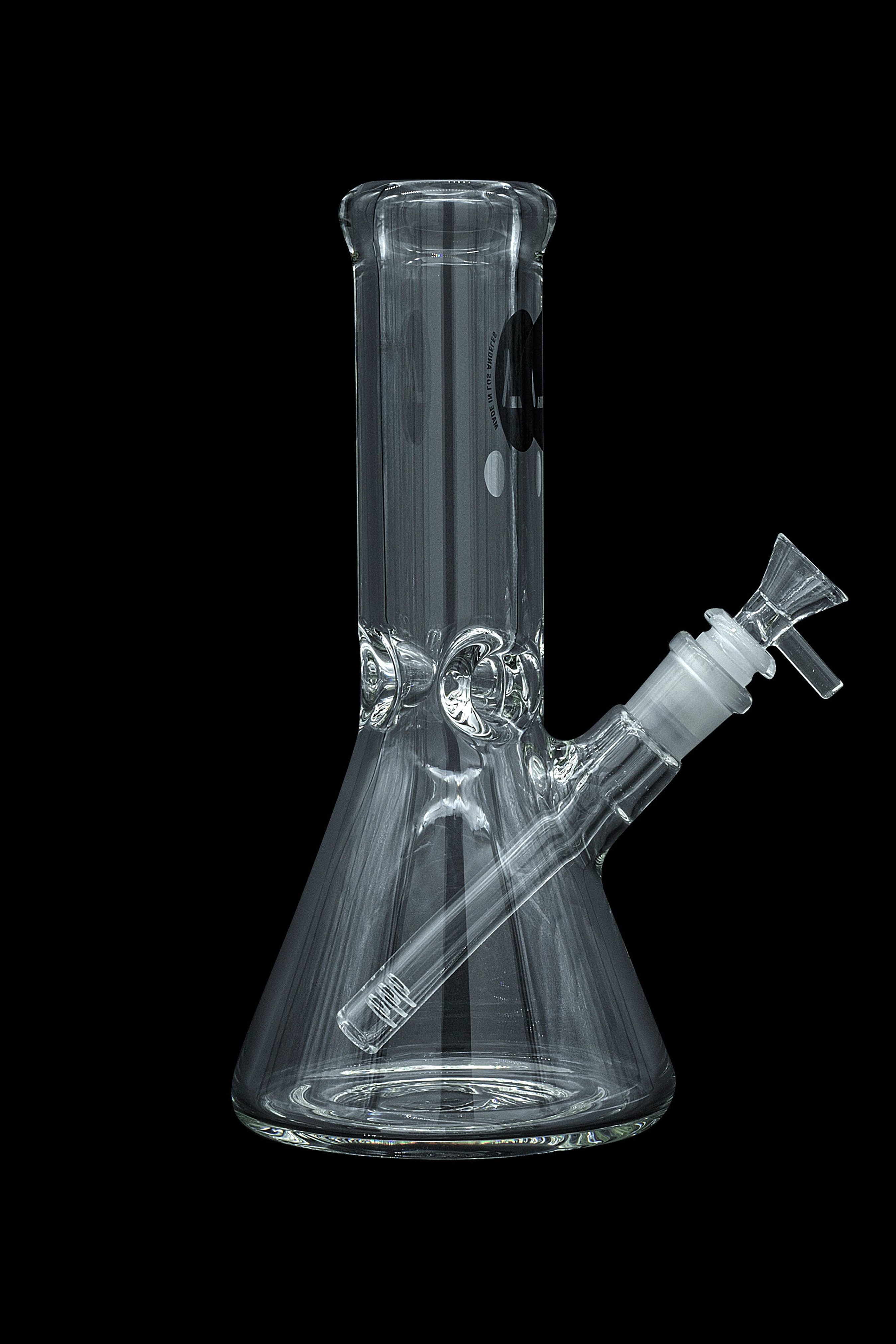 Clear glass bong with vertical lines and a removable downstem, isolated on a black background.