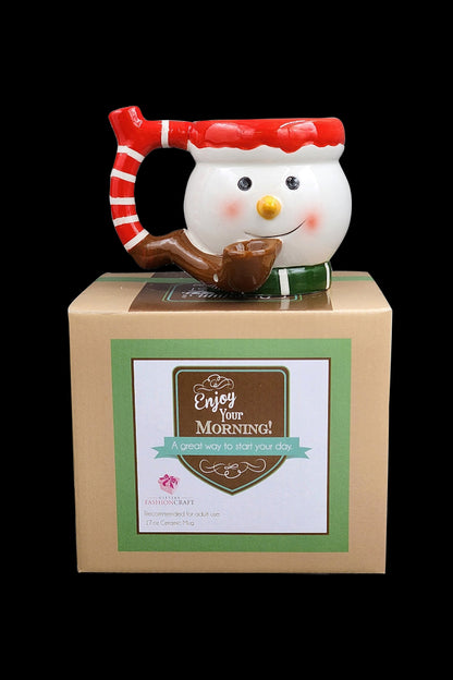 A snowman-shaped ceramic water pipe ("bubbler") in a gift box labeled “Enjoy Your Morning!” with text indicating recommended adult use.