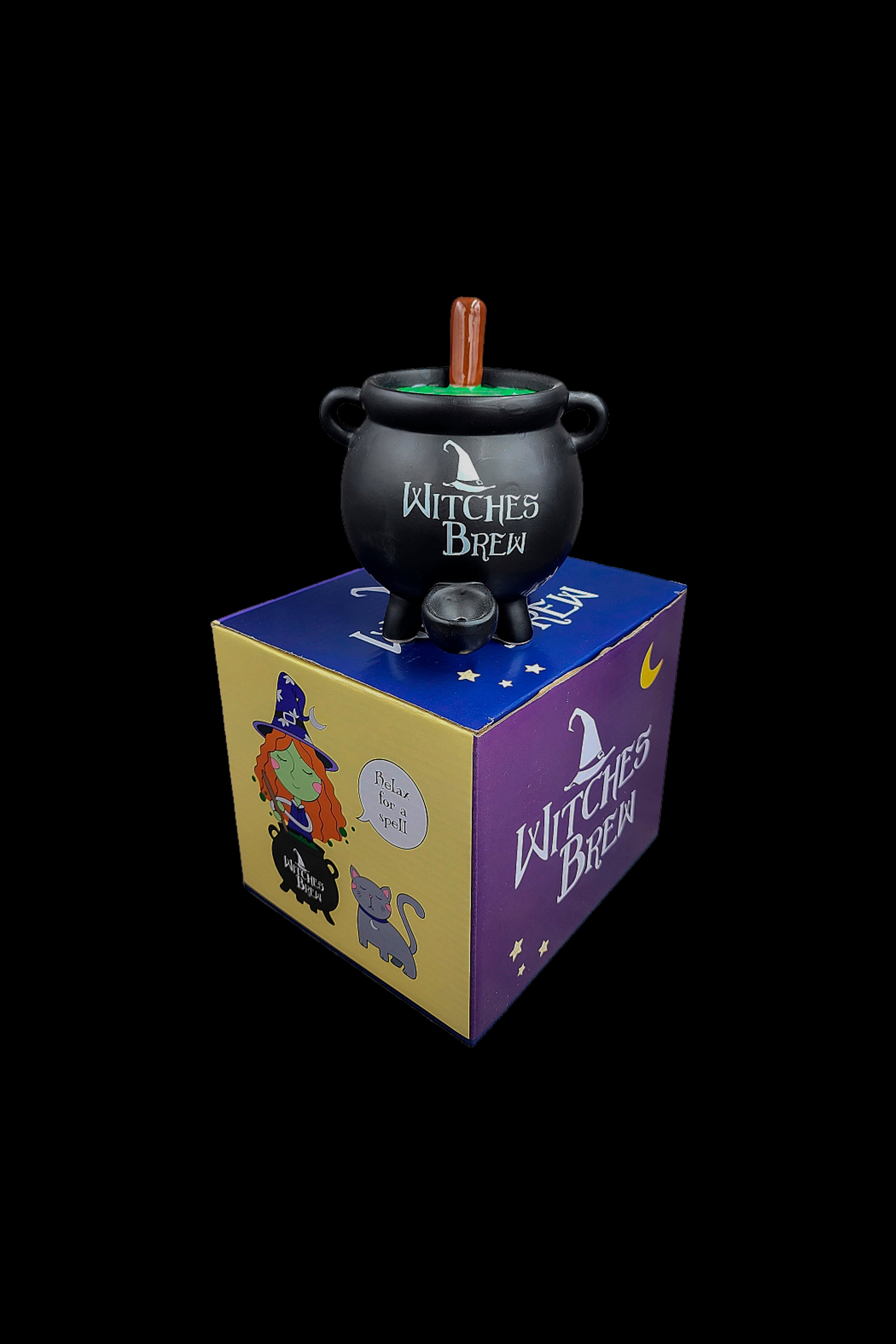 Halloween-themed cannabis accessory box with a cauldron-shaped smoking device inside, featuring witchy illustrations and branding.