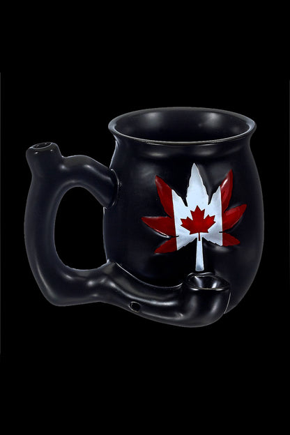 Black cannabis water pipe shaped like a cauldron with a Canadian maple leaf design.