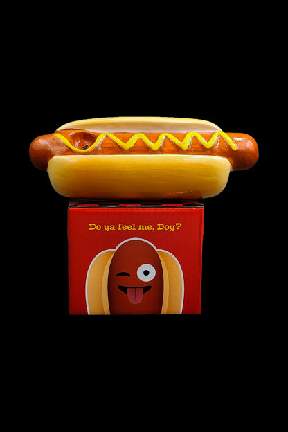 Hot dog-shaped cannabis packaging with a smiling cartoon hot dog face and the text "Do ya feel me, Dog?".