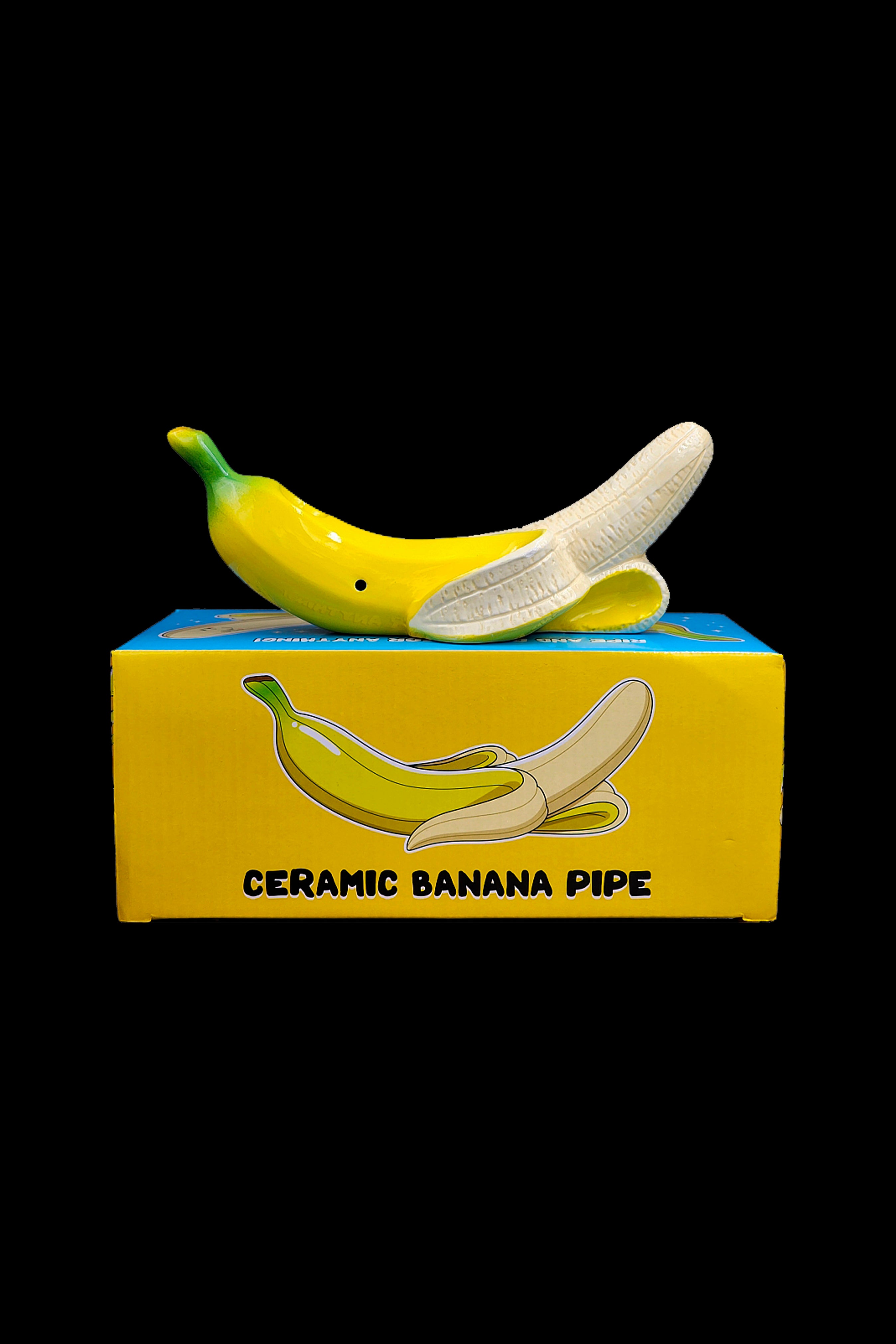Yellow ceramic banana pipe displayed in its packaging.