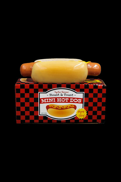 Mini hot dog-shaped container for cannabis concentrate or oil.