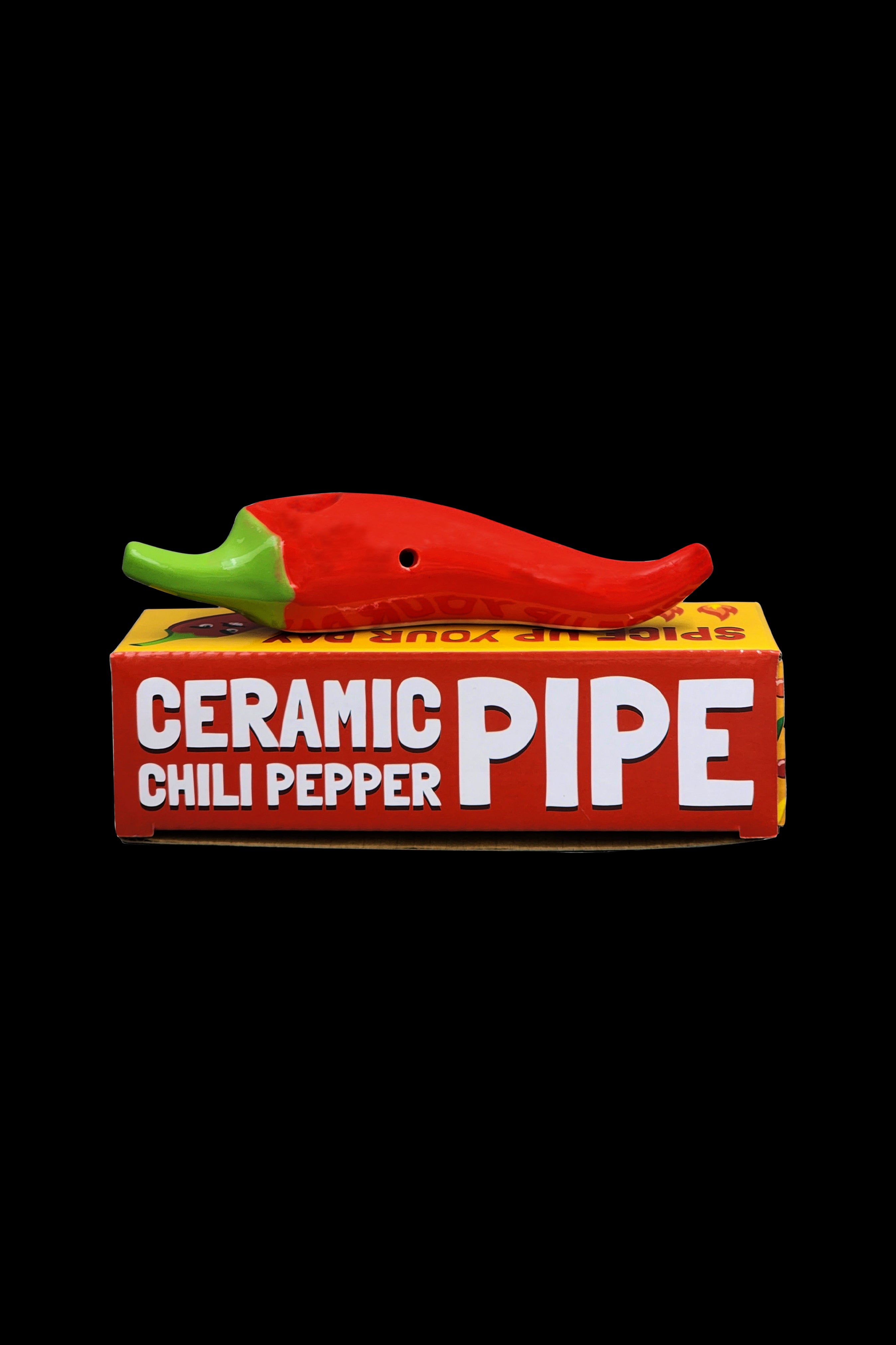 Red ceramic chili pepper pipe displayed in its packaging.