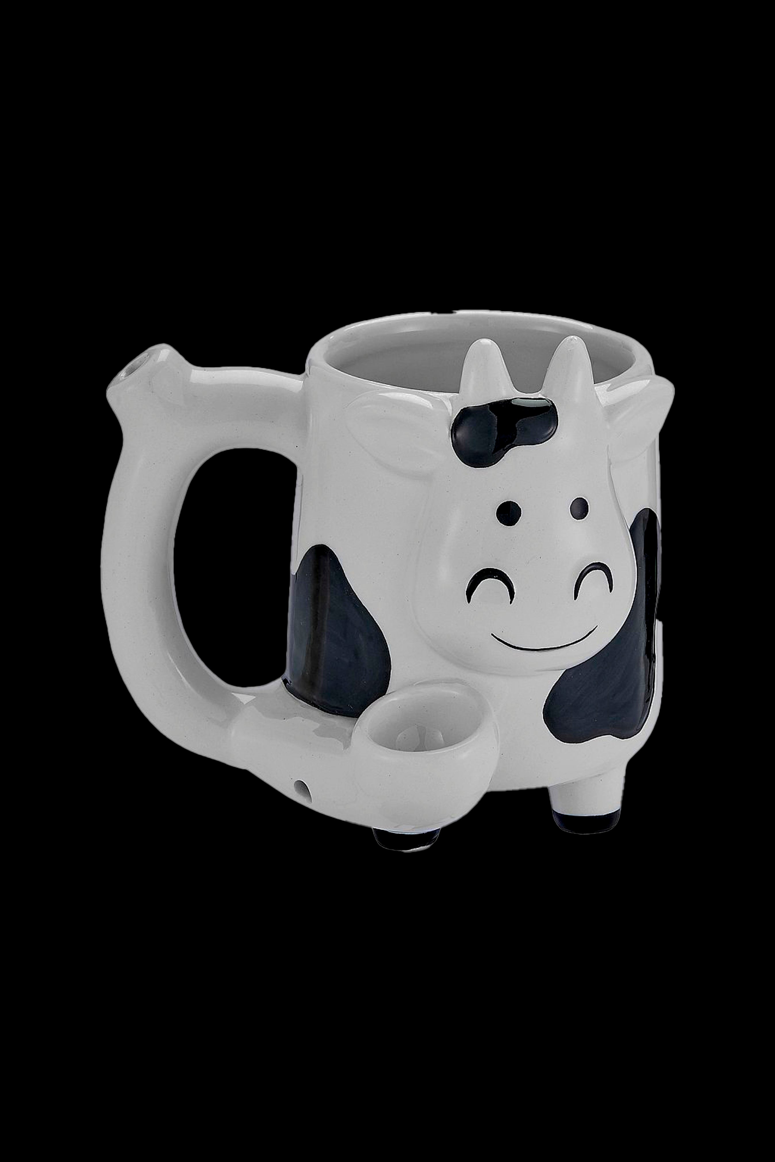 White and black cow-shaped glass bubbler with a smiling face.