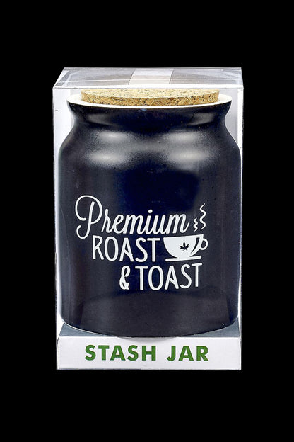 Black glass cannabis storage jar in clear packaging labeled “Premium Roast & Toast” and “Stash Jar”.