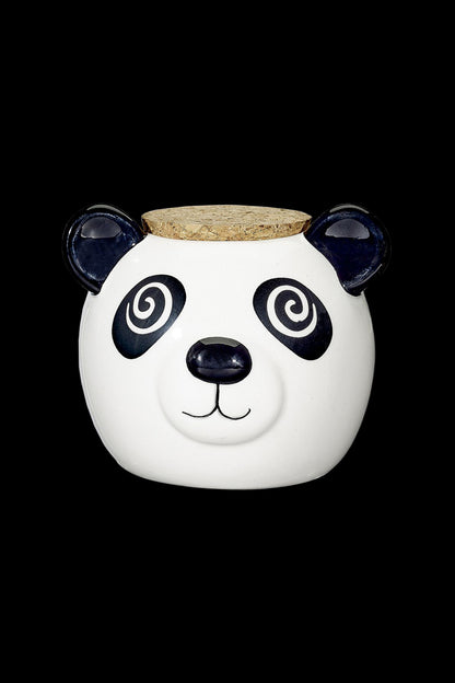 White ceramic jar shaped like a panda with a cork lid, likely for cannabis storage.