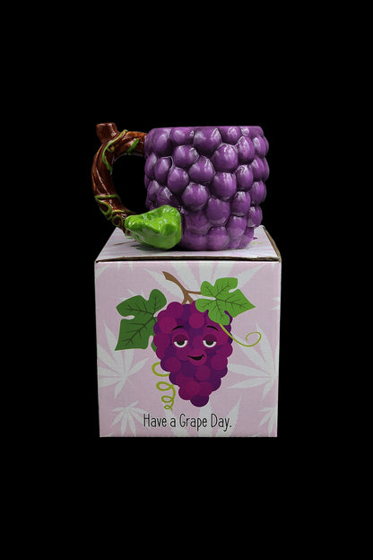 Purple grape-shaped box with a cartoon grape face and the text "Have a Grape Day," likely containing a cannabis accessory.
