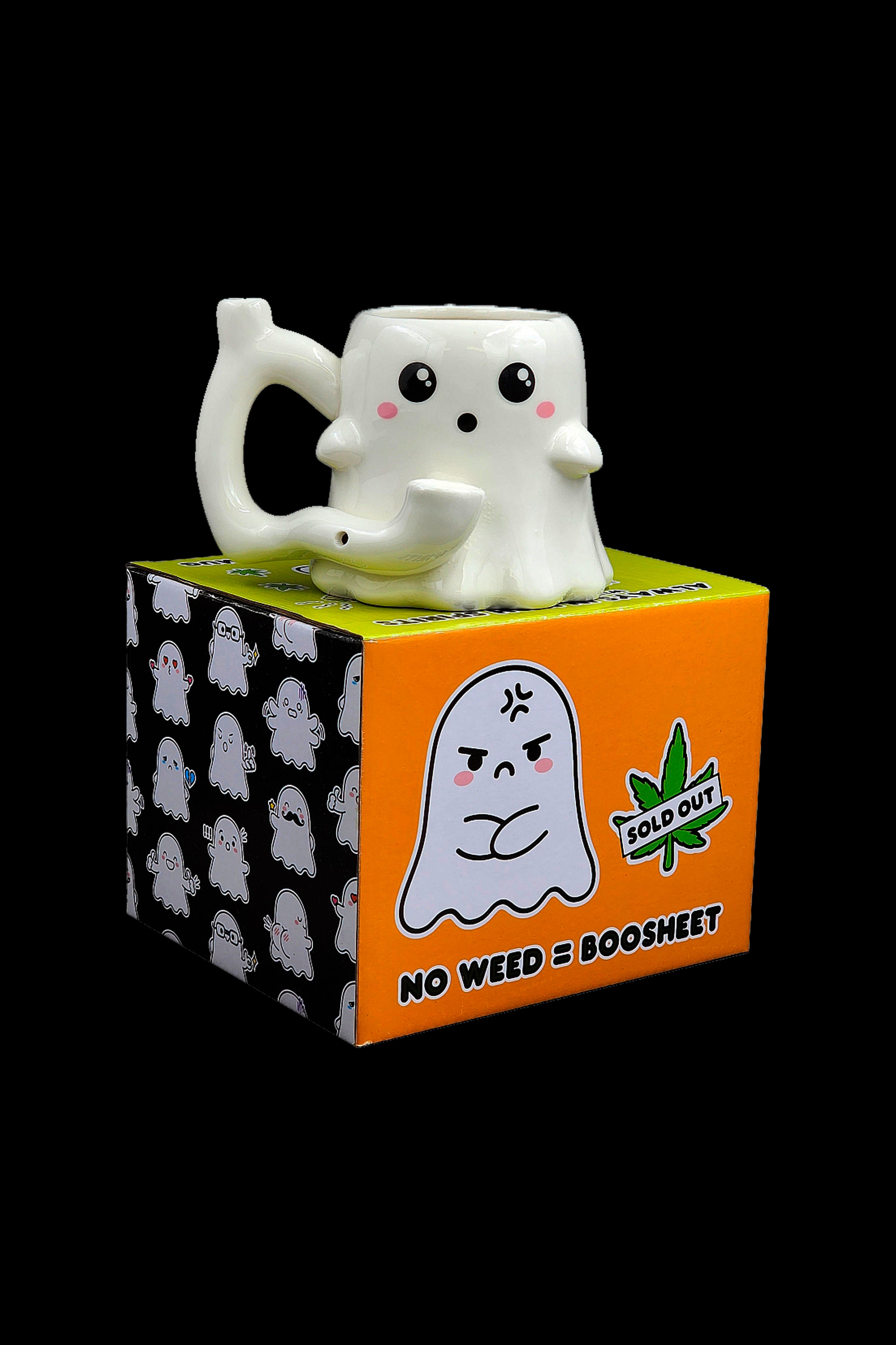 A ceramic ghost-shaped smoking pipe rests on its branded box, which features a repeating ghost pattern and text reading “NO WEED = BOOSHEET” with a “SOLD OUT” leaf-shaped sticker.