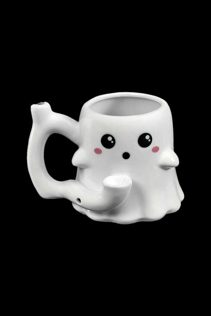 Cute ghost-shaped ceramic mug with a small pipe protruding from its base, isolated on a black background.