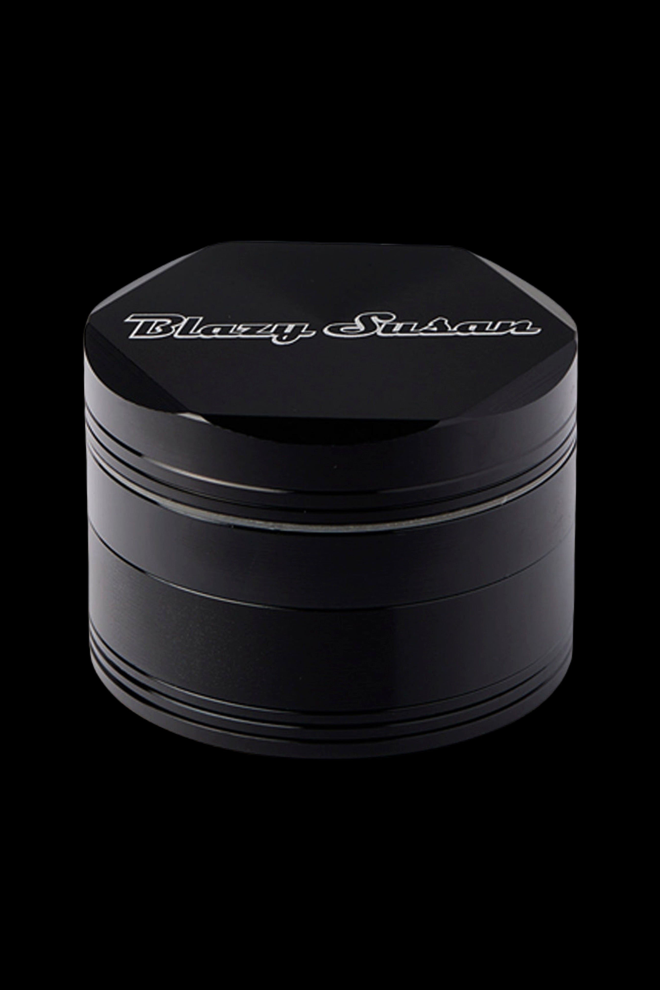 Black four-layer cannabis grinder with "Blazy Susan" logo.