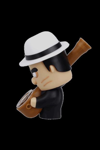 Stylized vinyl figure of a man in a fedora smoking a pipe, likely a cannabis accessory.