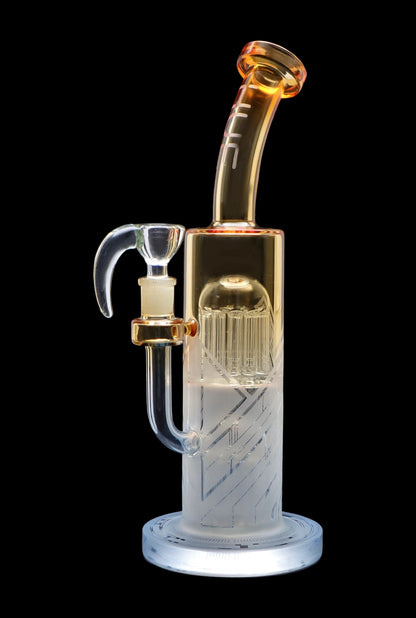 Clear glass water pipe (bong) with intricate percolator filtration system, isolated on black."