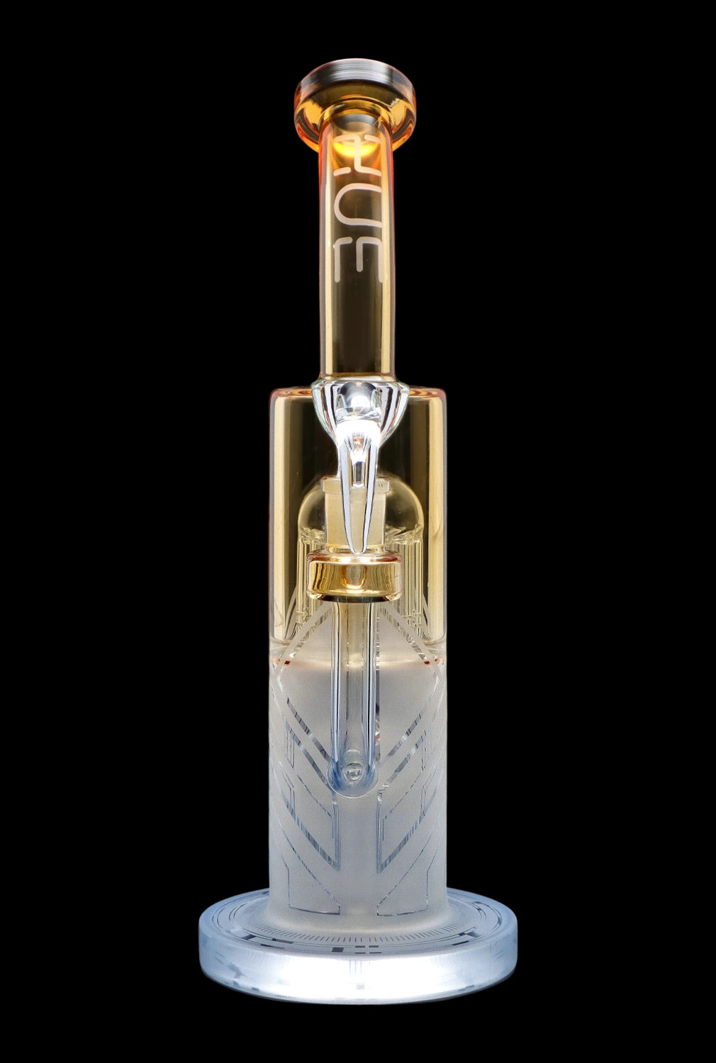 Clear glass water pipe (rig) with intricate etching and amber accents, isolated on a black background.