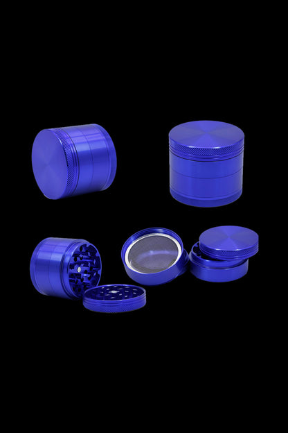 Blue four-piece cannabis grinder with various views displayed on a black background.