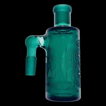 Close-up side view of the teal glass Milkyway Maya Wet Ash Catcher showing its 90° joint, textured Maya-inspired relief and matte finish against a black background.
