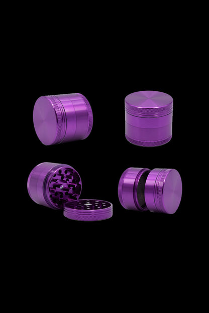 Purple four-piece cannabis grinder set displayed on a black background.