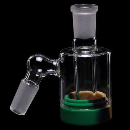 Close-up angled view of the Smoke Cartel 3.5-inch Silicone Base Reclaim Ash Catcher showing its clear glass joint and red-black silicone base against a black background.