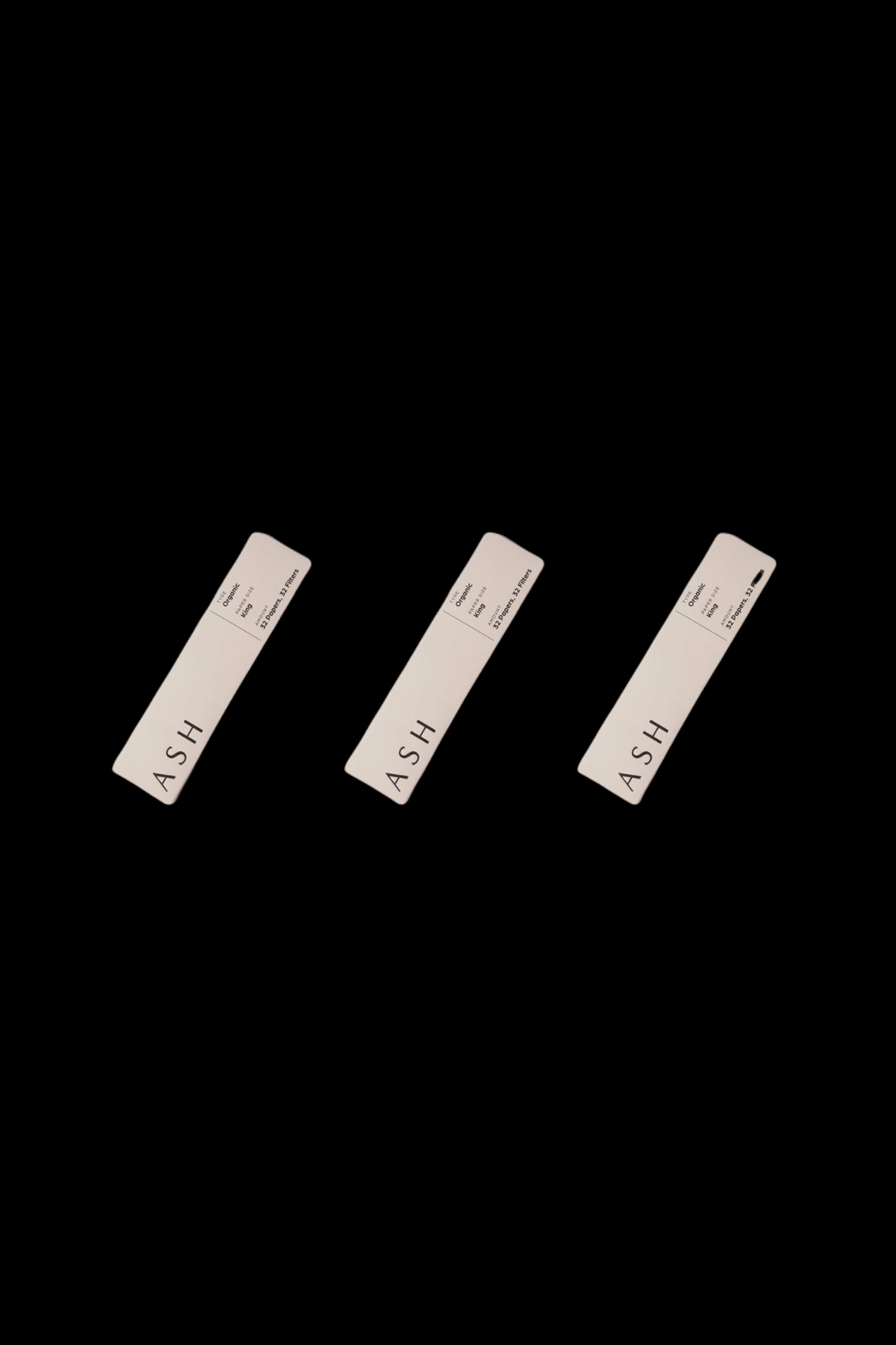 Three minimalist, rectangular cannabis pre-roll packs labeled "ASH" against a black background.