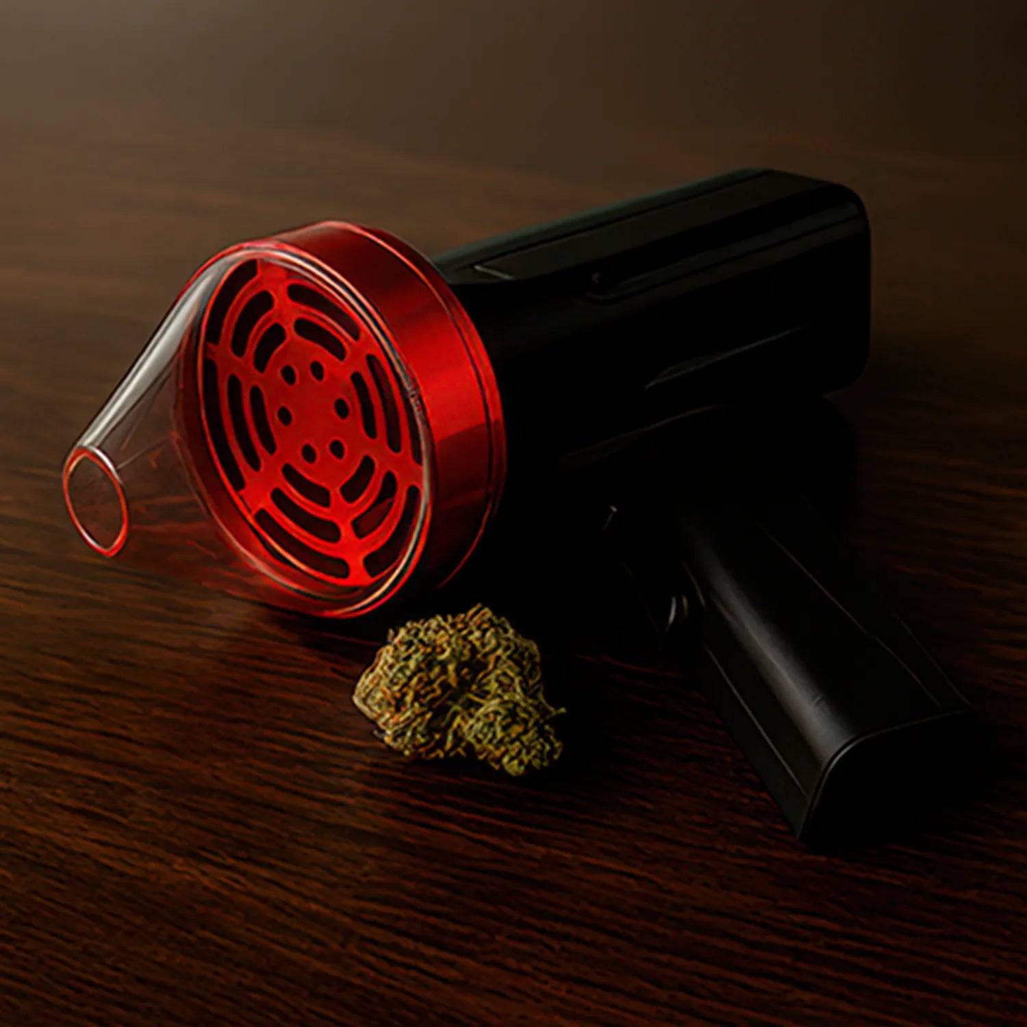 Angled close-up of the Cloudious9 The Auto9 Fully Automatic Grinder with a red translucent front piece and black body resting on a dark wood surface.